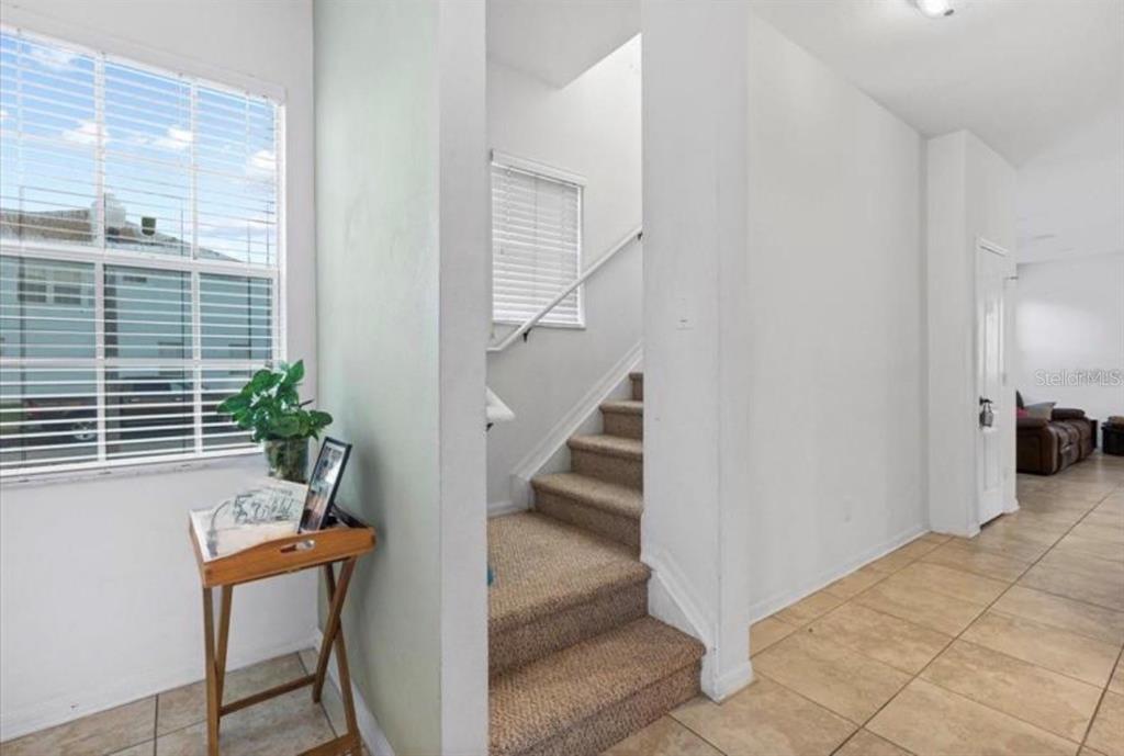 3115 Capri Isle Way Orlando, FL 32835 - Photo 11 of 40 a view of a hallway with seating area