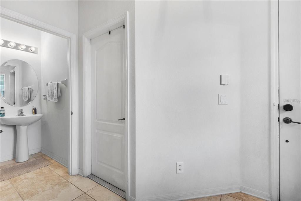 3115 Capri Isle Way Orlando, FL 32835 - Photo 12 of 40 a bathroom with a sink and mirror