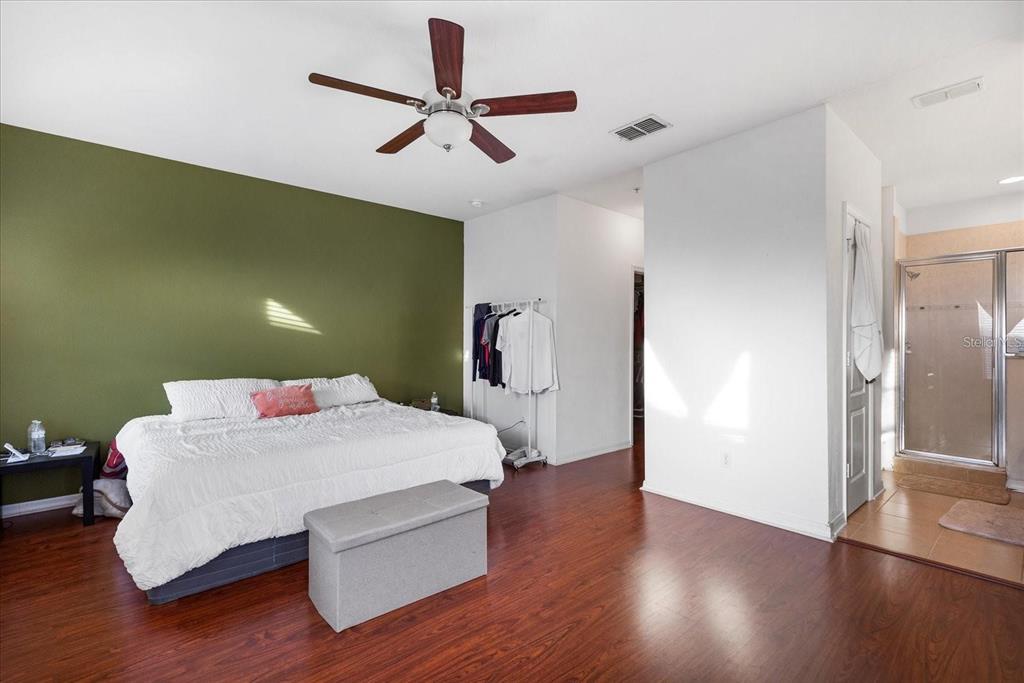 3115 Capri Isle Way Orlando, FL 32835 - Photo 24 of 40 a room with a bed and a hallway