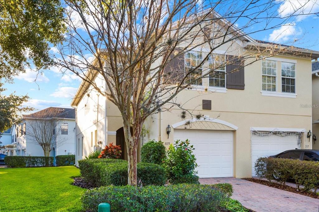 3115 Capri Isle Way Orlando, FL 32835 - Photo 3 of 40 a front view of a house with garden