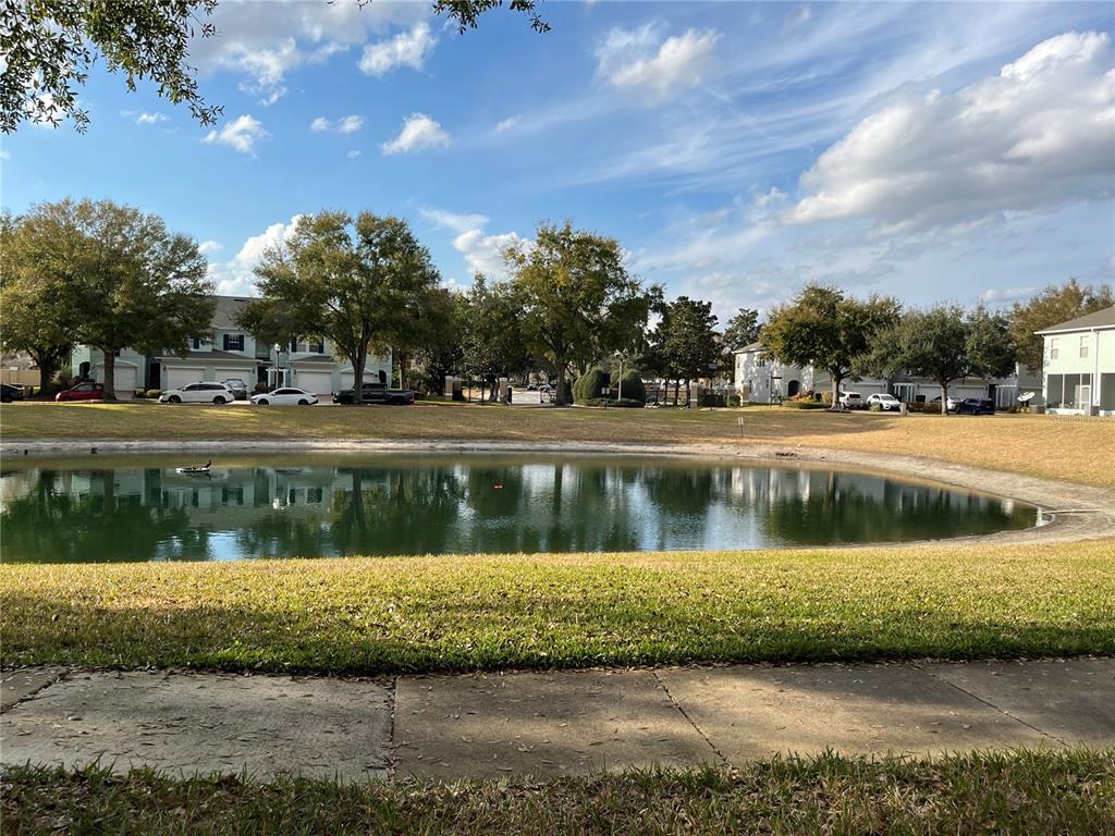 3115 Capri Isle Way Orlando, FL 32835 - Photo 34 of 40 a view of lake with a house