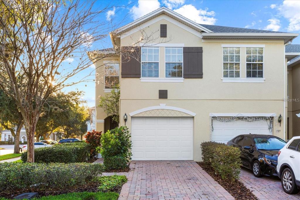 3115 Capri Isle Way Orlando, FL 32835 - Photo 6 of 40 a front view of a house with a garden