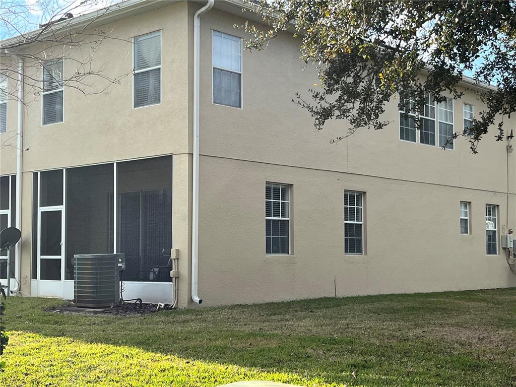 3115 Capri Isle Way Orlando, FL 32835 - Photo 10 of 40 a view of house with backyard porch