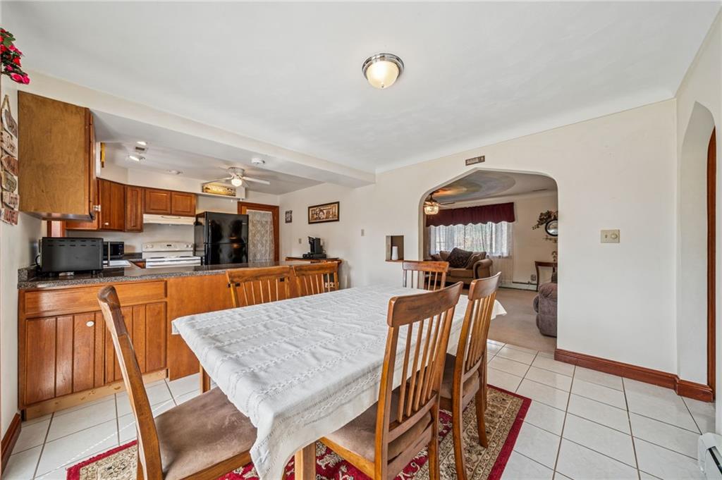 974 Renton Road Pittsburgh, PA 15239 - Photo 11 of 48 a view of a dining room with furniture