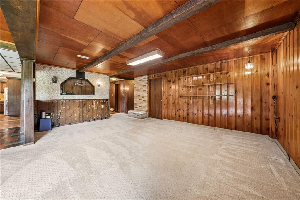 974 Renton Road Pittsburgh, PA 15239 - Photo 26 of 48 a big room with closet and a wooden roof