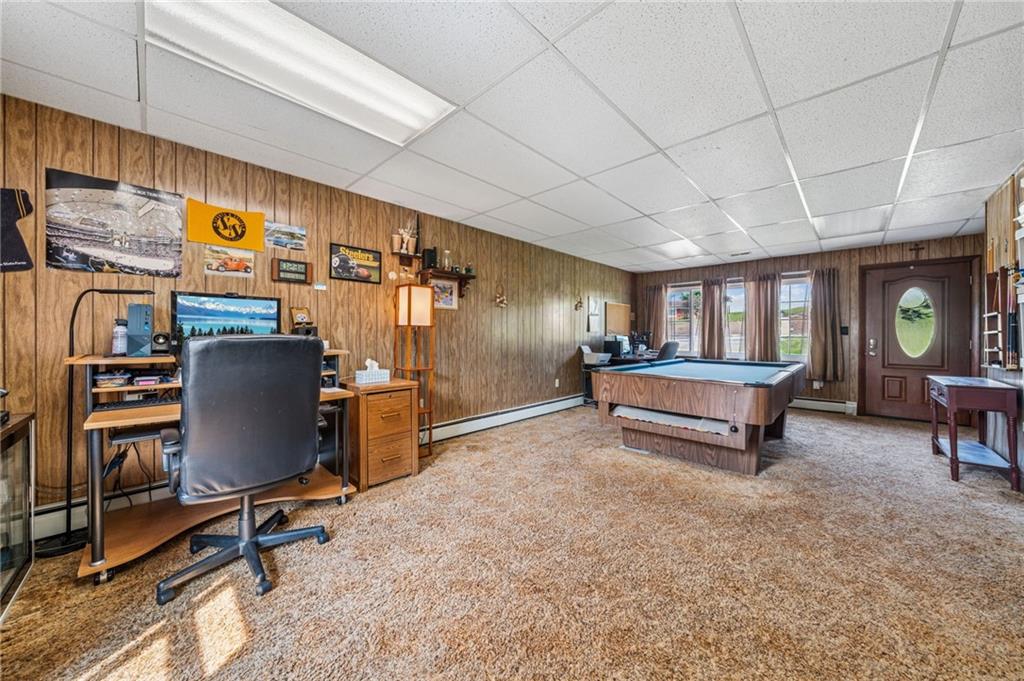 974 Renton Road Pittsburgh, PA 15239 - Photo 8 of 48 a living room with furniture gym equipment and a table