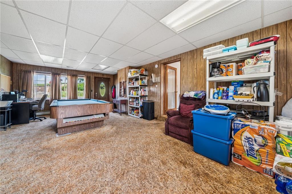 974 Renton Road Pittsburgh, PA 15239 - Photo 10 of 48 a living room with furniture and a bookshelf