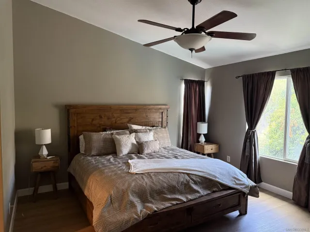 a bedroom with a bed and window