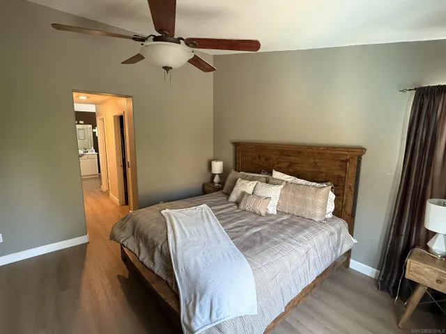 a bedroom with a bed and a mirror