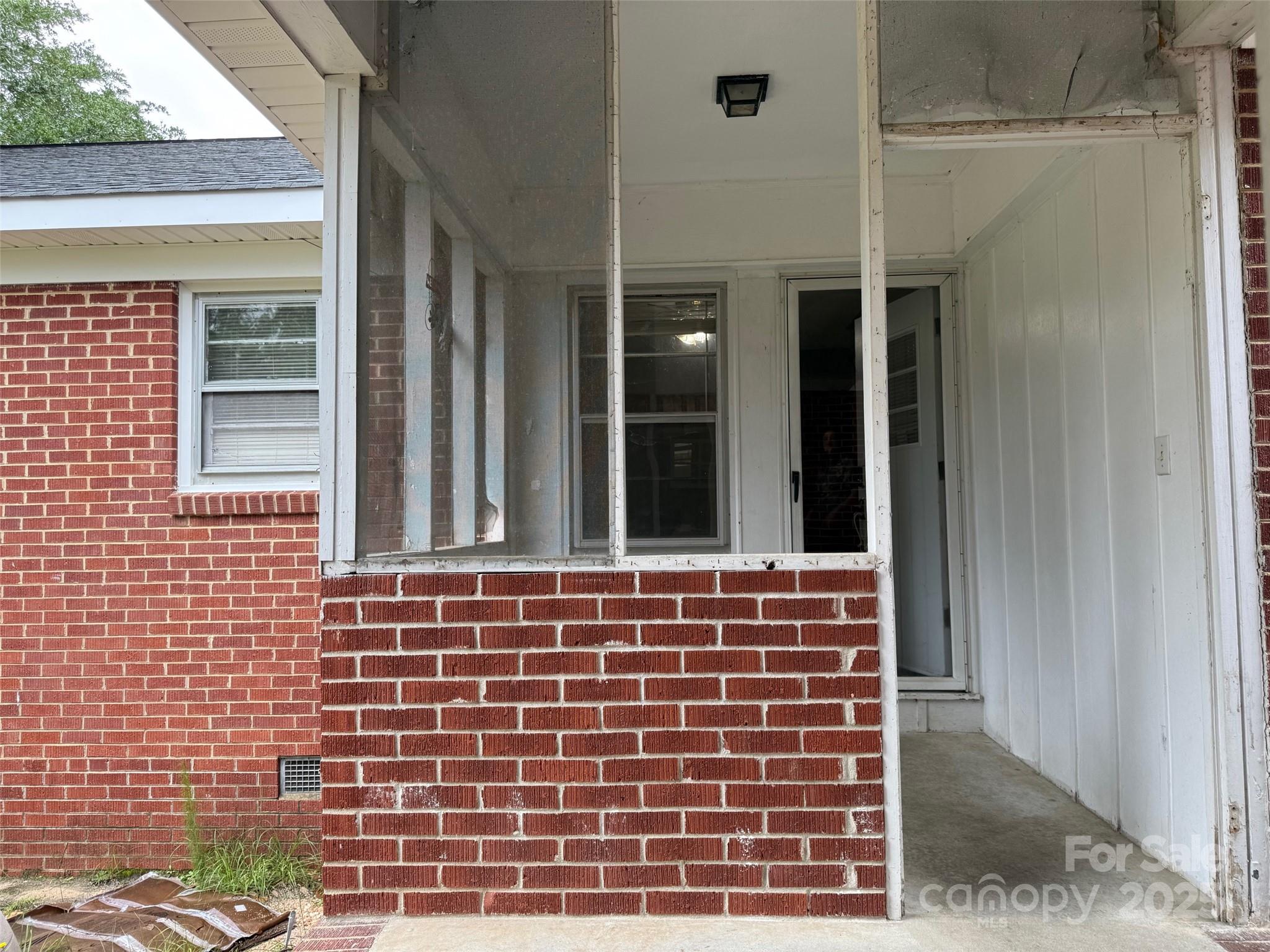 4463 Highway 52 Cheraw, SC 29520 - Photo 18 of 21 a view of front door of house and window