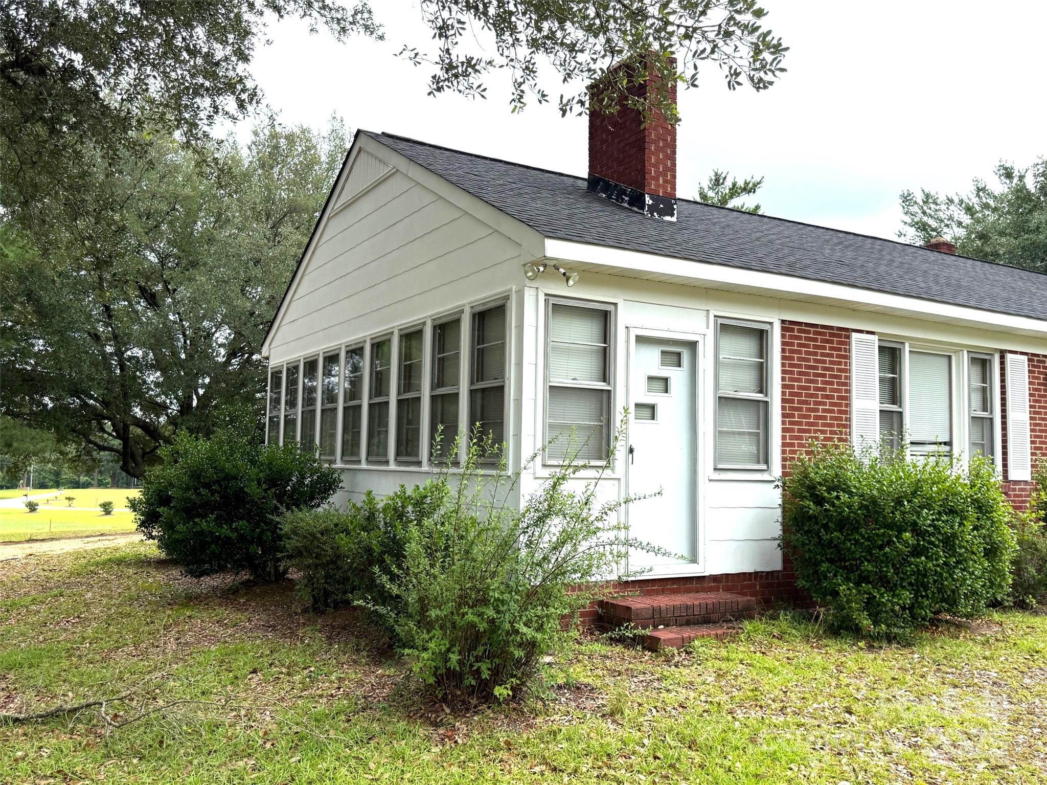 4463 Highway 52 Cheraw, SC 29520 - Photo 3 of 21 a front view of a house with garden