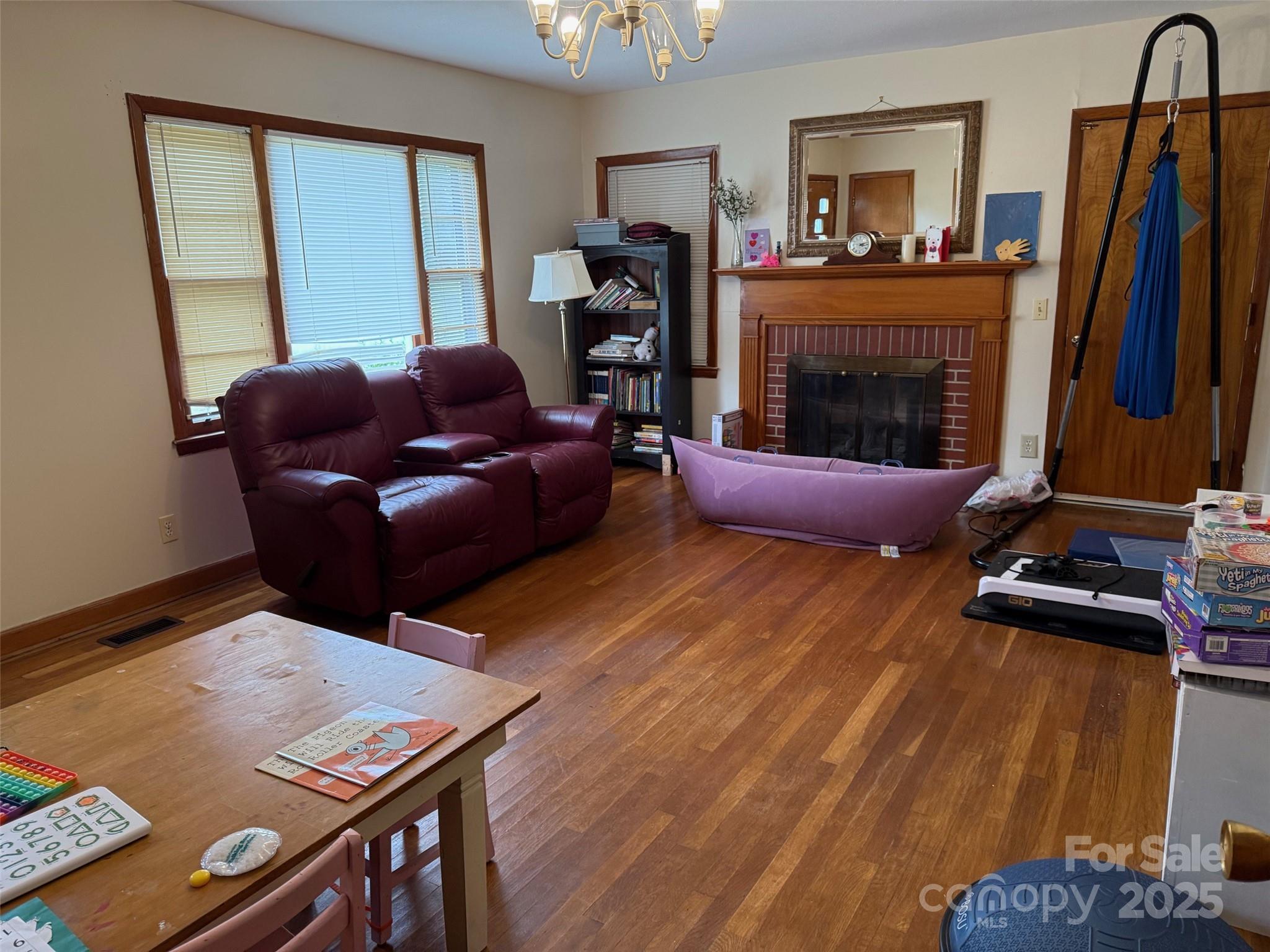 4463 Highway 52 Cheraw, SC 29520 - Photo 8 of 21 a living room with furniture and a fireplace