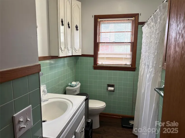 a bathroom with a sink and toilet