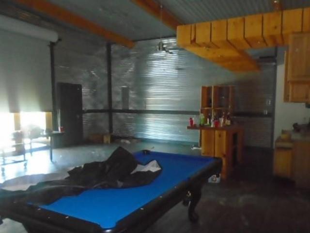 1264 Ballard Road Van Alstyne, TX 75495 - Photo 8 of 9 a room with pool table and windows