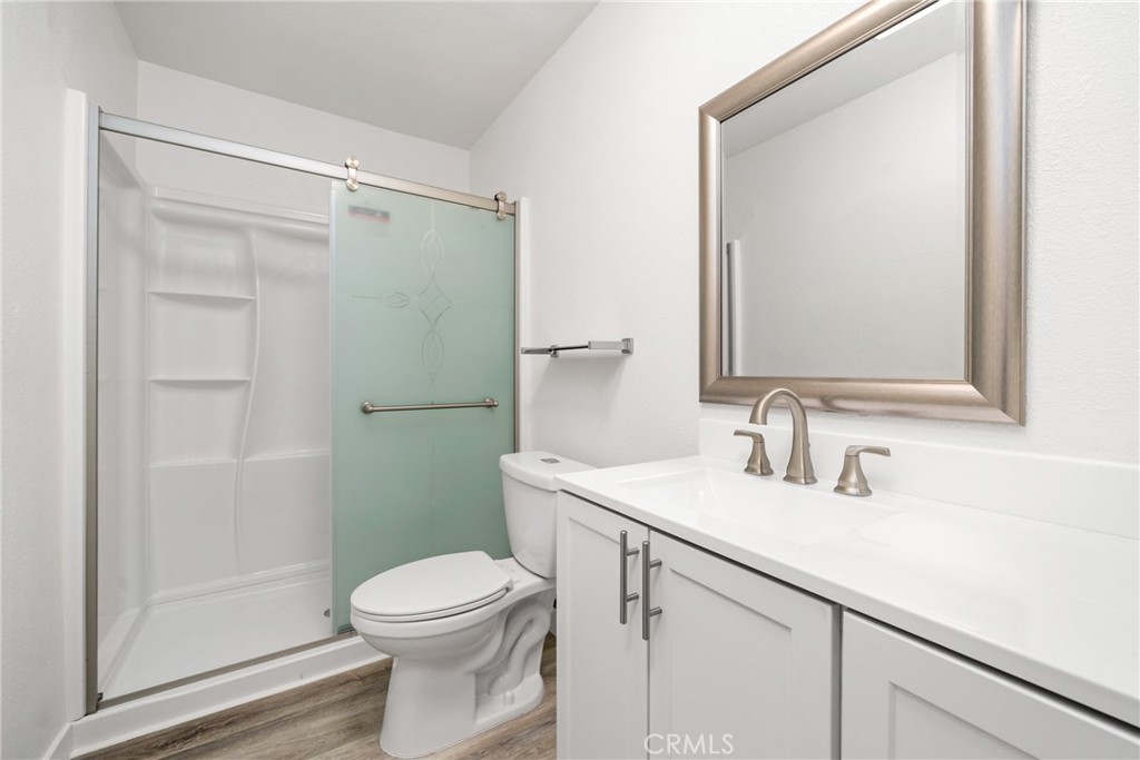 483 South Pine Street Orange, CA 92866 - Photo 11 of 14 a bathroom with a sink a toilet and shower