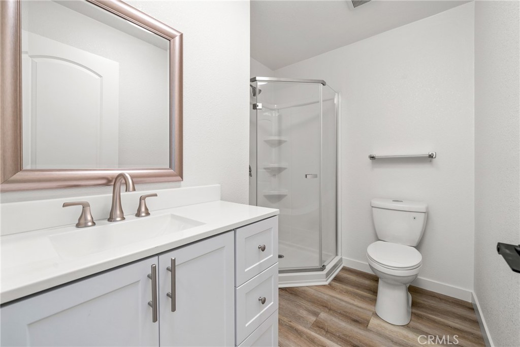483 South Pine Street Orange, CA 92866 - Photo 13 of 14 a bathroom with a toilet sink and mirror