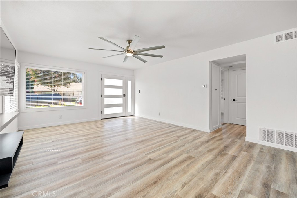 483 South Pine Street Orange, CA 92866 - Photo 3 of 14 a view of an empty room with a window and wooden floor