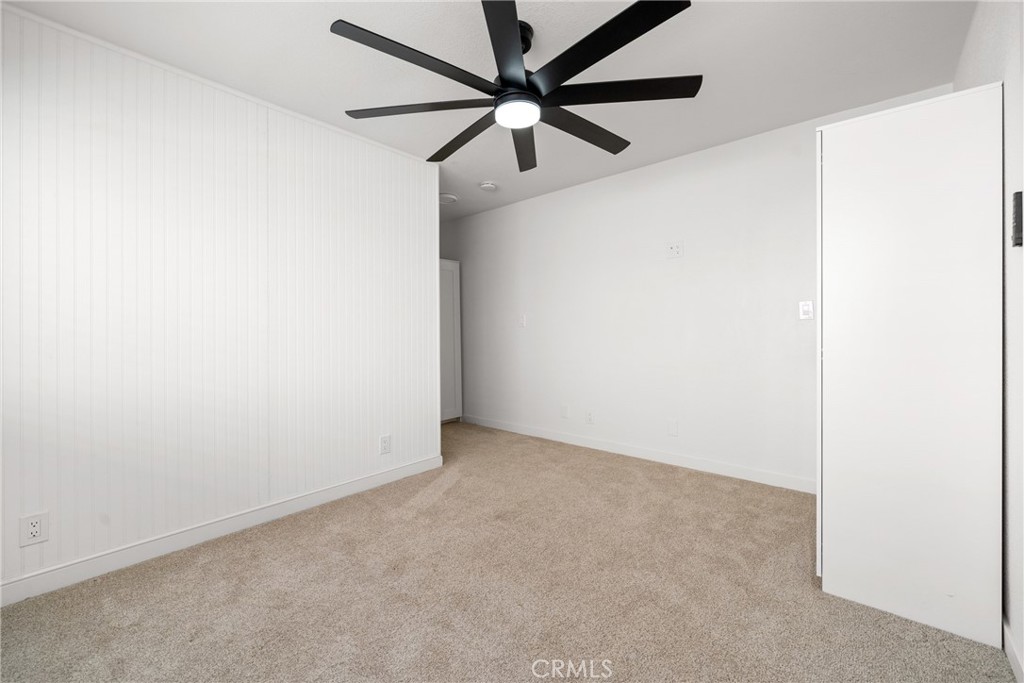 483 South Pine Street Orange, CA 92866 - Photo 10 of 14 an empty room with a ceiling fan and a window