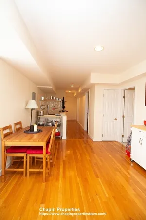 a living room with a table and chairs
