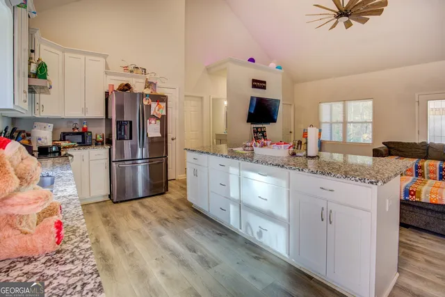 a kitchen with cabinets a sink and appliances