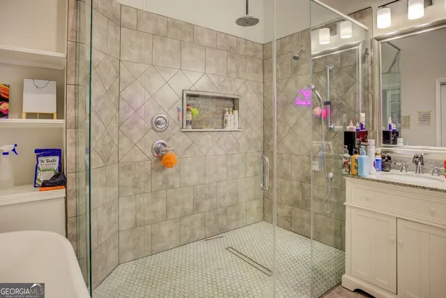 a bathroom with a shower and a sink