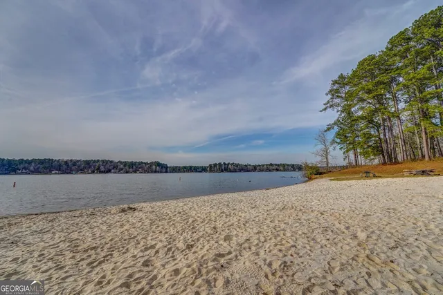 a view of an ocean beach and mountain