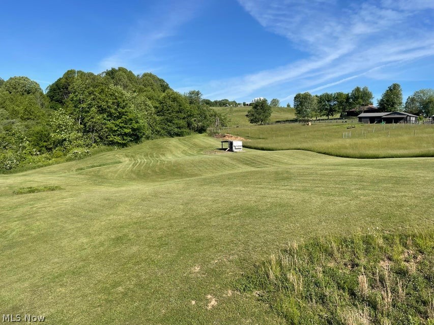 15393 Shade Road Guysville, OH 45735 - Photo 27 of 35 Expansive green landscape with rolling terrain and distant treeline