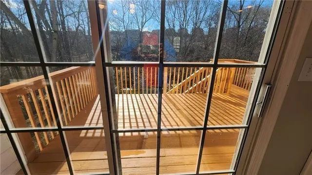 a view of empty room with floor to ceiling window