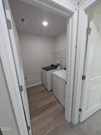 a utility room with a sink a washer and dryer