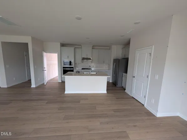 a view of kitchen with wooden floor