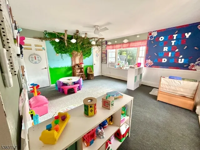 a play room with toys and a couch