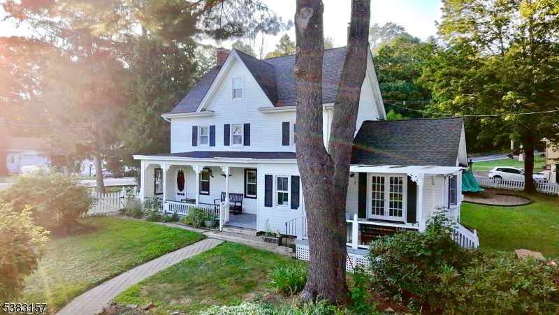 49 Brooklyn Road Stanhope, NJ 07874 - Photo 2 of 22 a front view of a house with garden