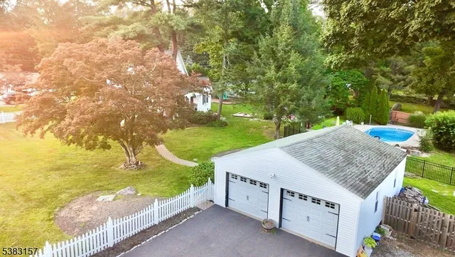 a view of a backyard with open kitchen