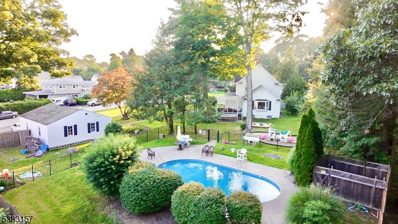 49 Brooklyn Road Stanhope, NJ 07874 - Photo 6 of 22 an aerial view of a house with a garden and plants