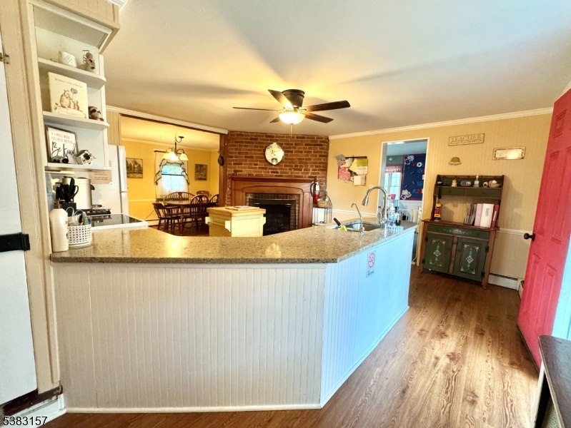 49 Brooklyn Road Stanhope, NJ 07874 - Photo 8 of 22 a large kitchen with stainless steel appliances a large counter top a stove a chimney a sink and dishwasher