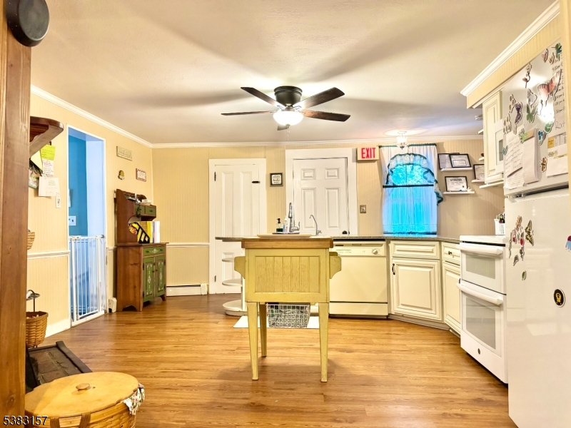 49 Brooklyn Road Stanhope, NJ 07874 - Photo 10 of 22 a living room with stainless steel appliances kitchen island granite countertop furniture and a large window