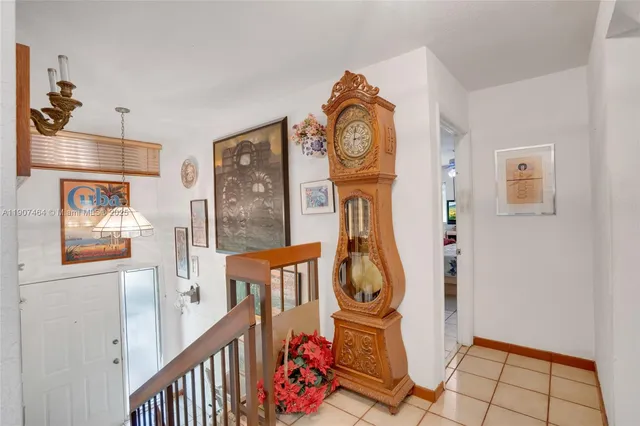 a view of an entryway with wooden floor and mirror