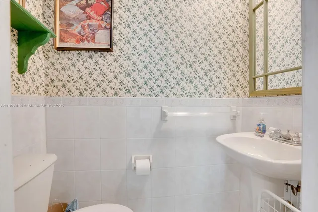 a view of a garage with rack and bicycle