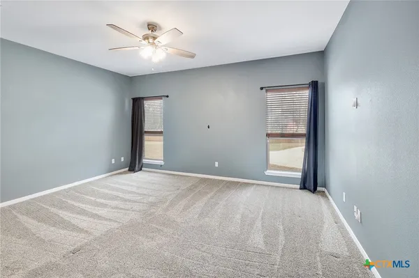 a view of an empty room with a window
