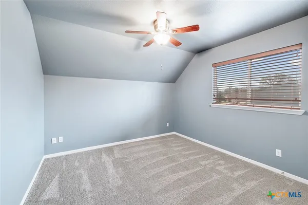 a view of a room with a fan