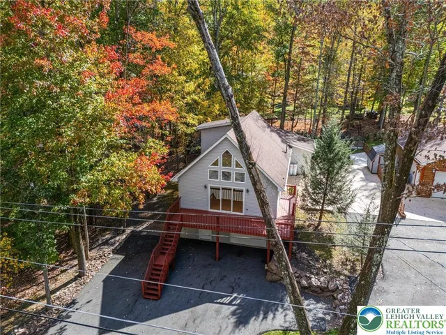 a house with trees in front of it
