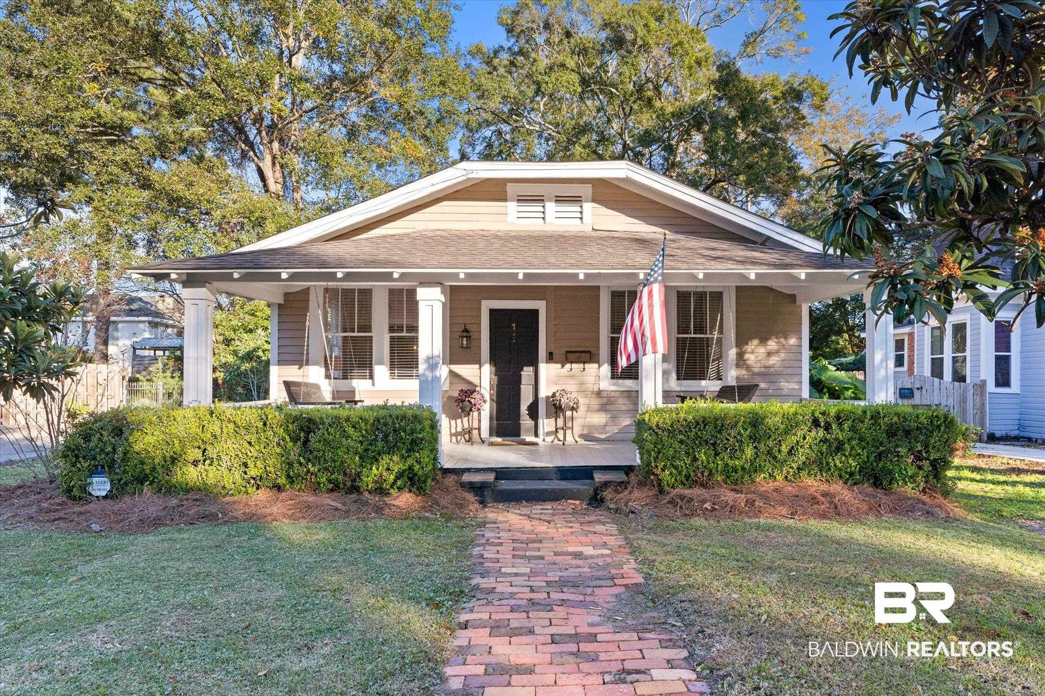 7 Rickarby Place Mobile, AL 36606 - Photo 1 of 20 Bungalow-style home featuring covered porch and a front yard