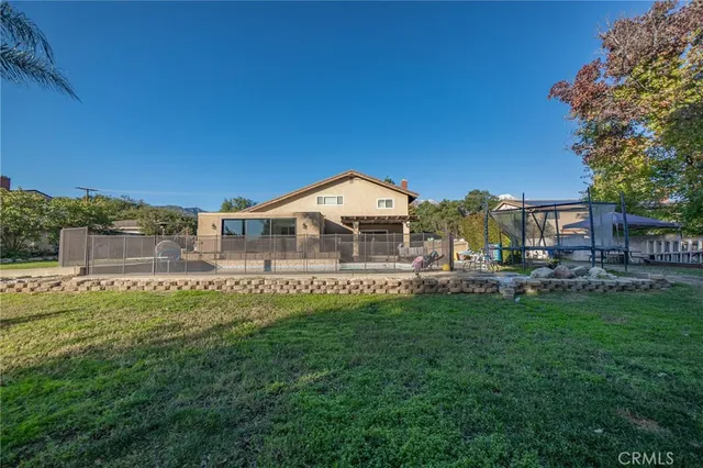 a view of a house with a yard porch and sitting area
