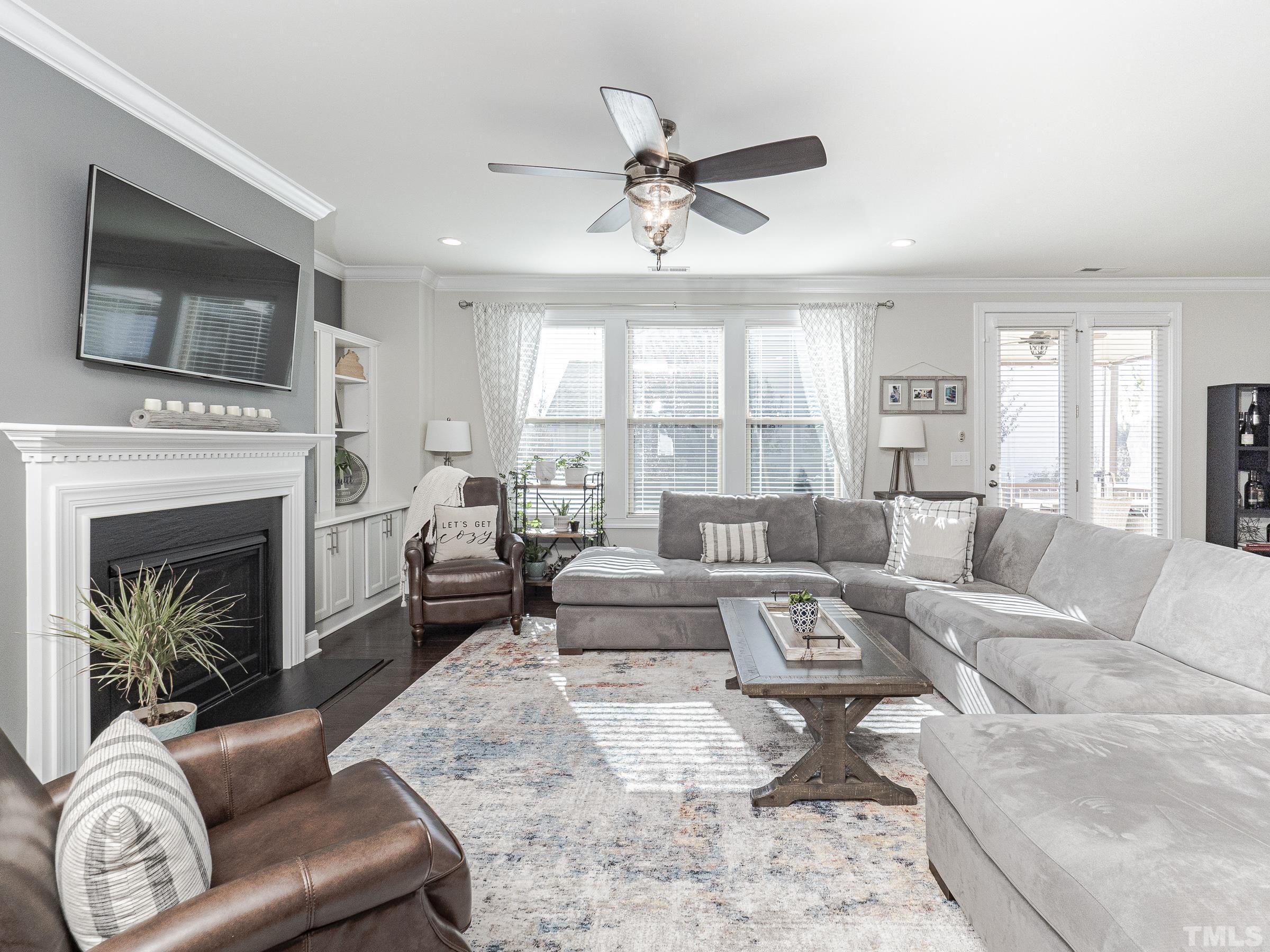 1303 Capstone Drive Durham, NC 27713 - Photo 12 of 27 a living room with furniture fireplace and flat screen tv