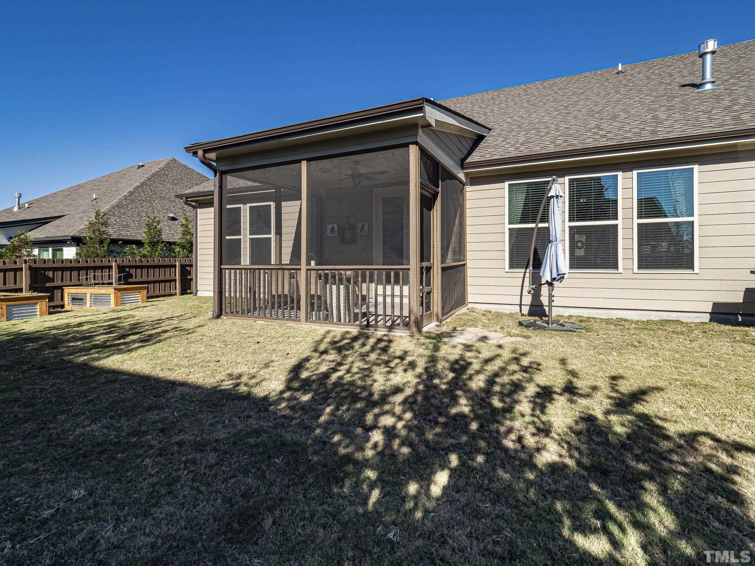 1303 Capstone Drive Durham, NC 27713 - Photo 25 of 27 a front view of a house with garden