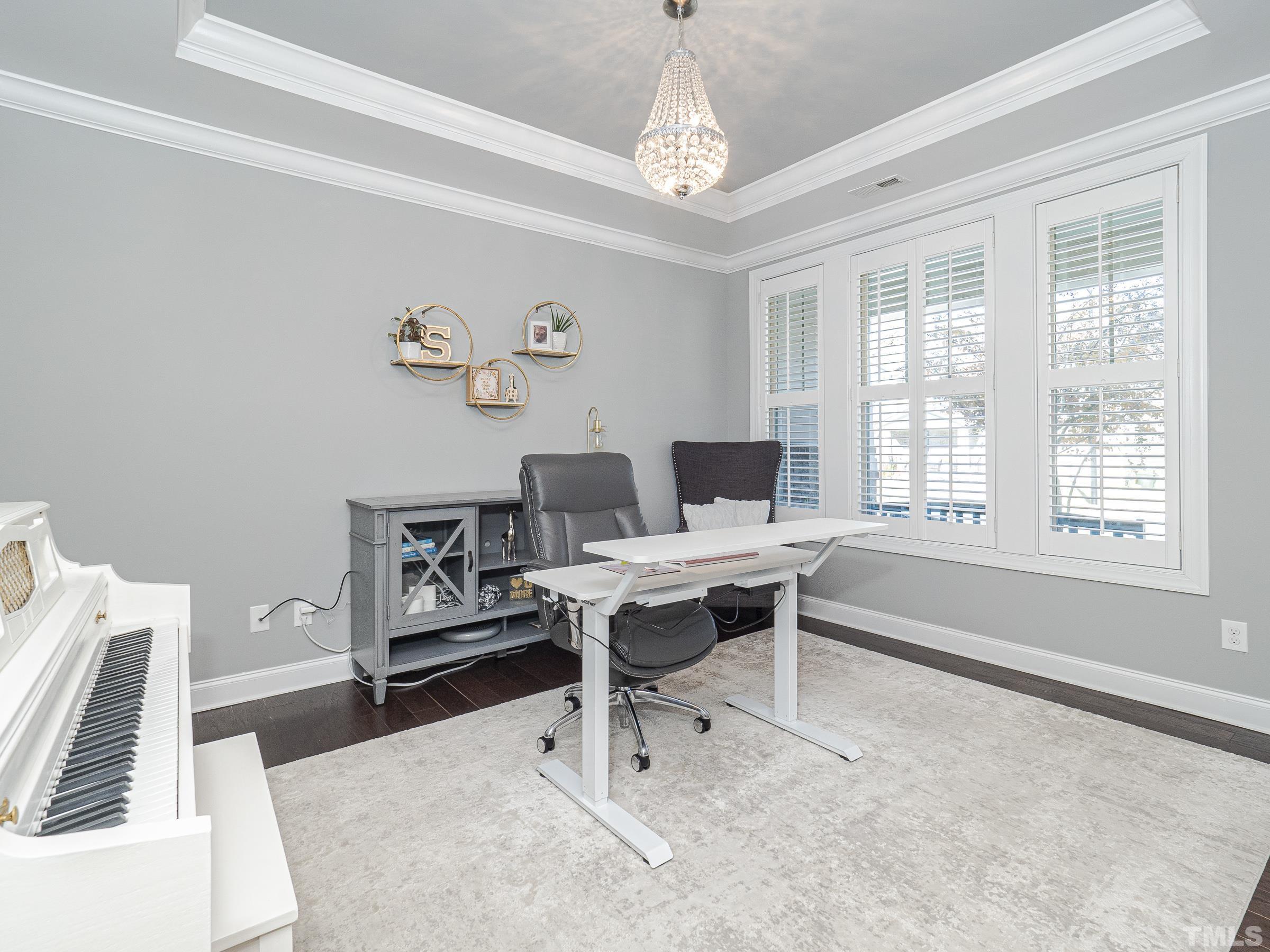 1303 Capstone Drive Durham, NC 27713 - Photo 4 of 27 a view of a workspace with furniture and a window