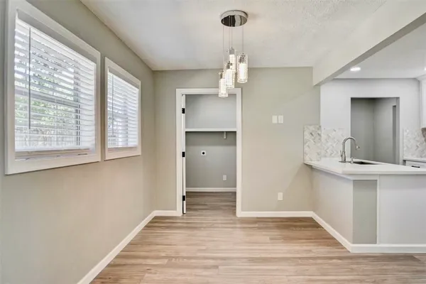 a kitchen with stainless steel appliances granite countertop a sink a stove a microwave and cabinets