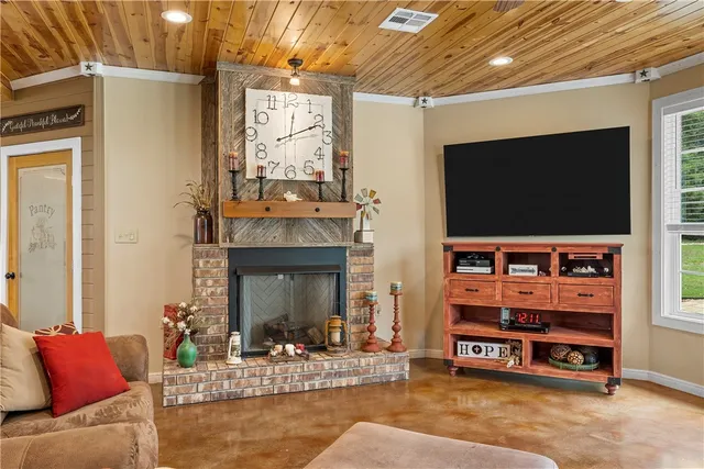 a view of a livingroom with furniture and staircase