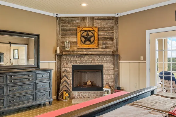 a living room with furniture a flat screen tv and gym equipment
