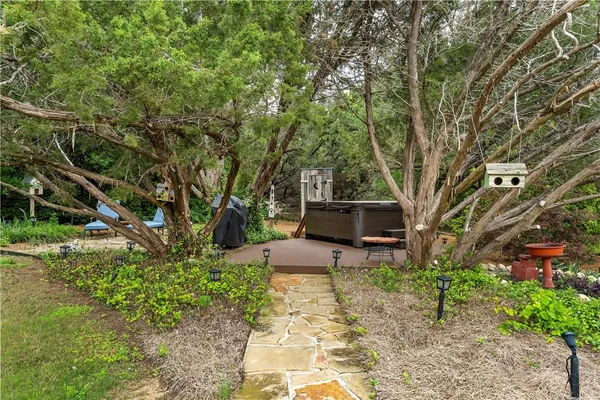 a front view of a house with a yard table and chairs